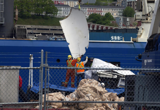 Debris from the Titan submersible, recovered from the ocean floor near the wreck of the Titanic, is unloaded from the ship Horizon Arctic at the Canadian coast guard pier in St. John's, Newfoundland, June 28, 2023. 