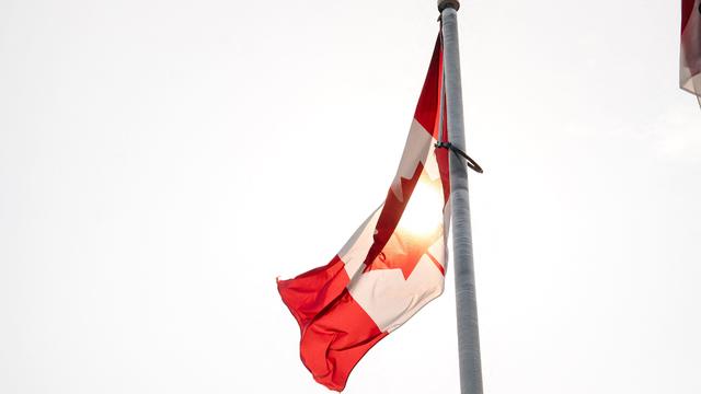 A Canadian flag waves at the BlackBerry campus in Waterloo, Ontario, September 23, 2013. 