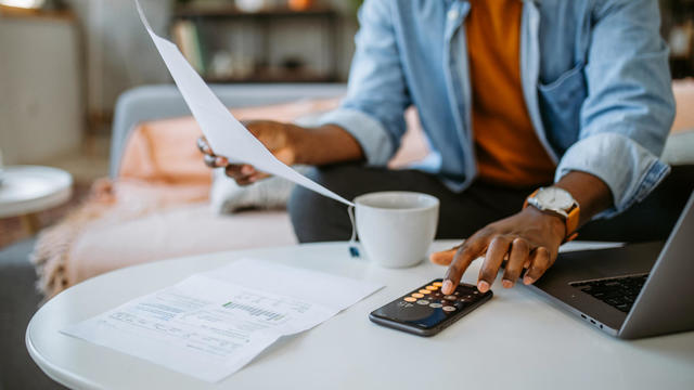 Man at home managing finances 