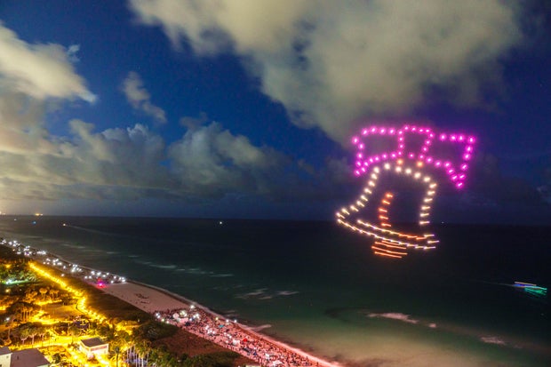 Drones light up in the shape of the LIberty Bell during a Fourth of July drone show in Miami Beach in 2022