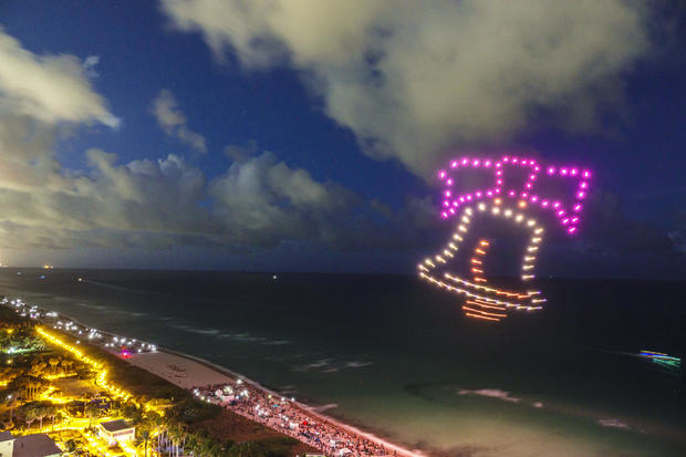 Drones light up in the shape of the LIberty Bell during a Fourth of July drone show in Miami Beach in 2022 