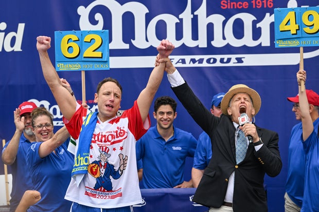 Defending champion Joey Chestnut cheers after taking first place in Nathan's Famous Hot Dog Eating Contest on the Fourth of July on July 4, 2023, at Coney Island in Brooklyn New York City.