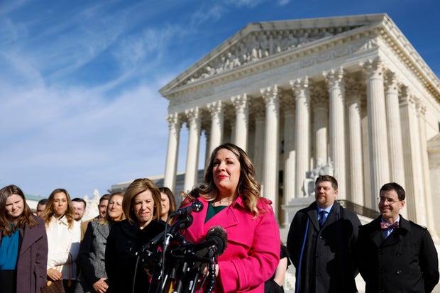 Lorie Smith speaks outside the U.S. Supreme Court building