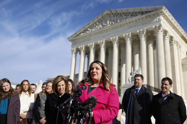 Lorie Smith speaks outside the U.S. Supreme Court building 
