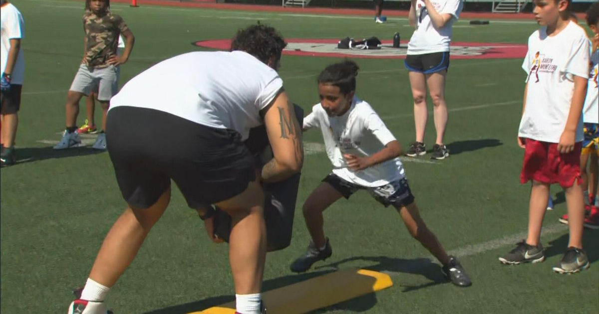 NFL player and Brockton native Aaron Monteiro hosts free football clinic for kids in his hometown