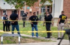 Authorities search for evidence at the scene of last nights mass shooting that left 2 dead and 20 wounded, on July 02 in Baltimore, MD. 