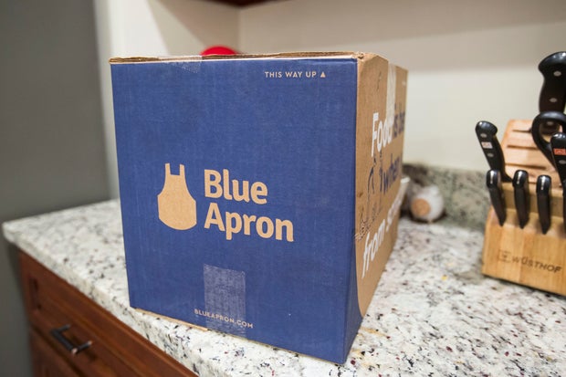 Blue Apron delivery box pictured on kitchen counter