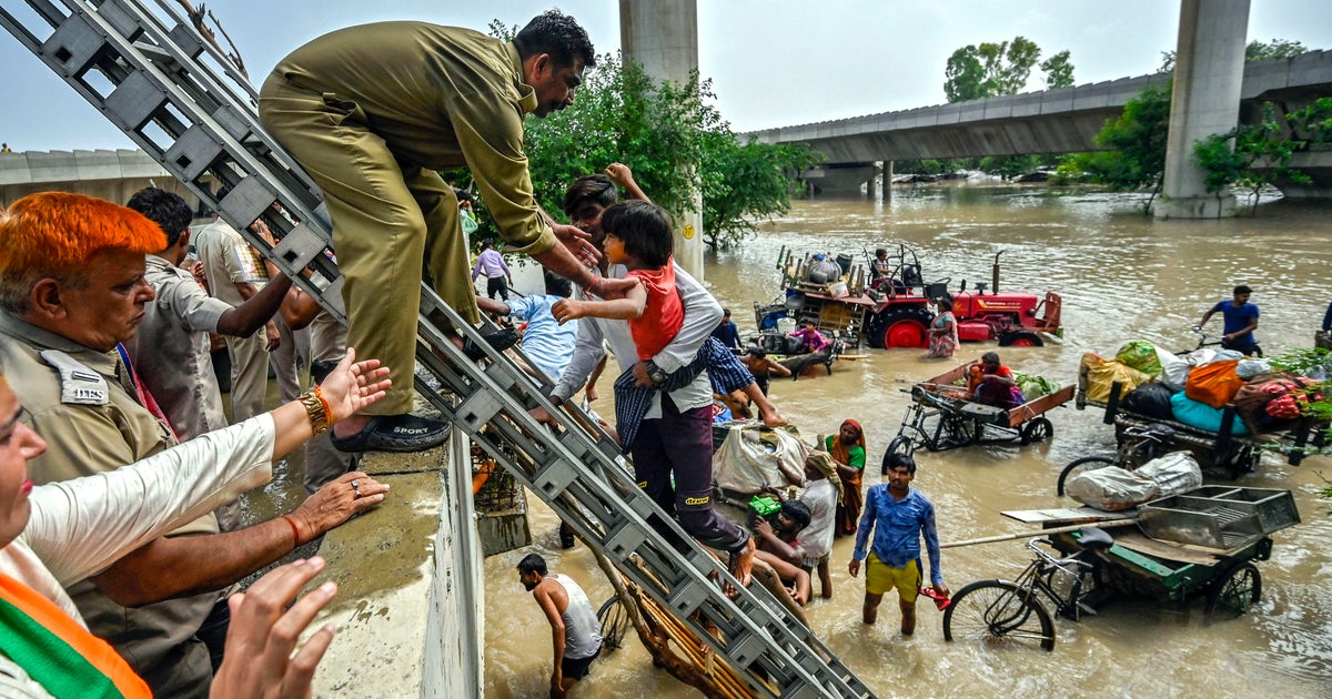 Indias monsoon rains flood Yamuna river in Delhi forcing thousands to evacuate and grinding life to a halt CBS News Indias monsoon rains flood Yamuna river in Delhi forcing thousands to evacuate and grinding life to a halt CBS News