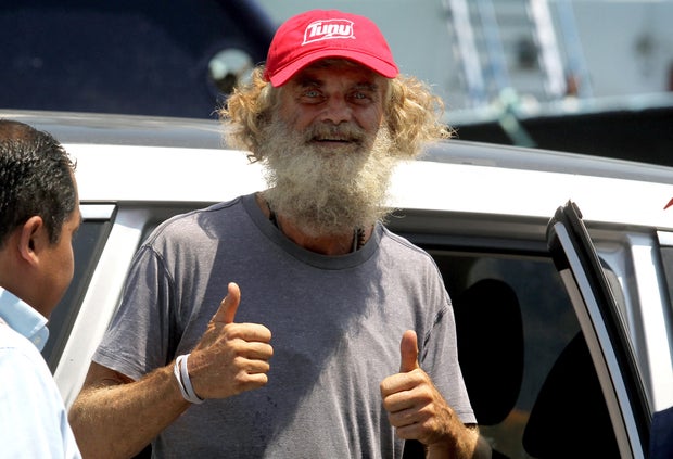 Australian sailor Tim Shaddock gives a thumbs up as he arrives at the port of Manzanillo, Mexico, on July 18, 2023
