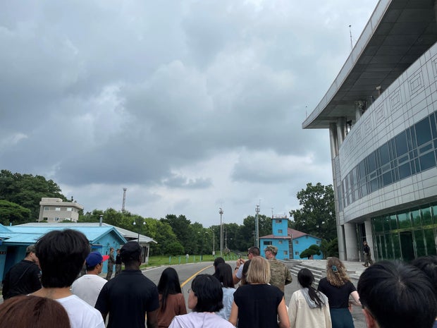U.S. Private 2nd Class Travis T. King, wearing a black shirt and black cap, is seen in this picture taken during a tour of the tightly controlled Joint Security Area on the border between North Korea and South Korea, at the truce village of Panmunjom, Sou