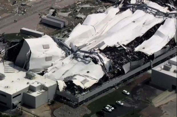 The roof of a Pfizer facility shows heavy damage after a tornado passed the area in Rocky Mount 