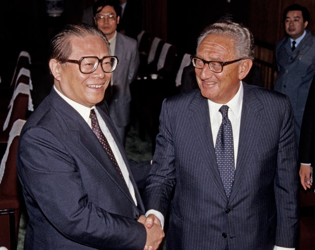 Chinese President Jiang Zemin shakes hands with former U.S. Secretary of State Henry Kissinger in Beijing, China, in a November 1989 file photo