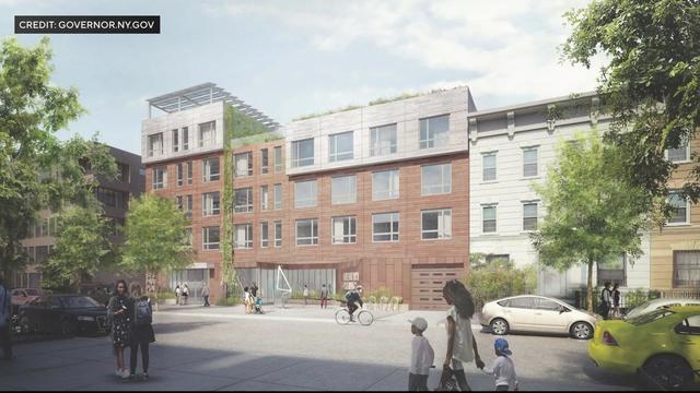 A rendering of a new affordable housing project in Crown Heights with a health clinic and greenery on the roof. 