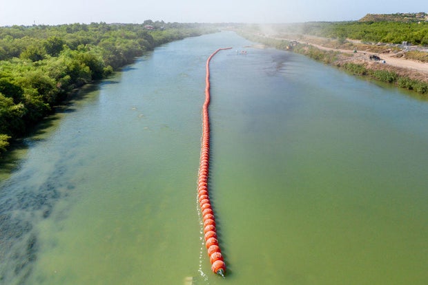 Buoy barriers are installed and situated in the middle of the Rio Grande river on July 18, 2023, in Eagle Pass, Texas.