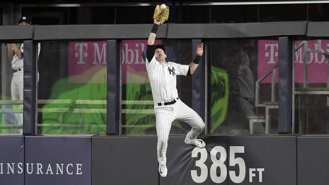 Billy McKinney #57 of the New York Yankees makes a catch for an out during the seventh inning against the Kansas City Royals at Yankee Stadium on July 21, 2023 in Bronx borough of New York City. 