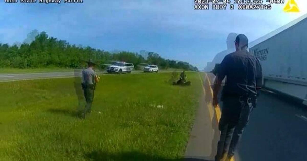 Body cam video shows police in Ohio release K-9 dog onto Black man as he appeared to be surrendering