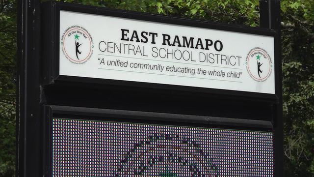 An LED sign that reads "East Ramapo Central School District" and "A unified community educating the whole child." 