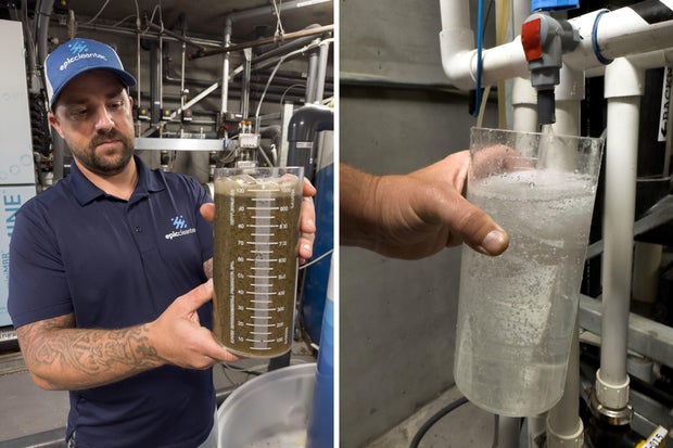 A man holds a beaker of treated wastewater, next to a container of cleaned drinking water