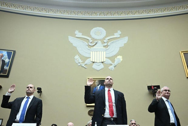 From left to right, Ryan Graves, David Grusch and David Fravor are sworn in to testify during a House subcommittee hearing on UAP on Capitol Hill on July 26, 2023.