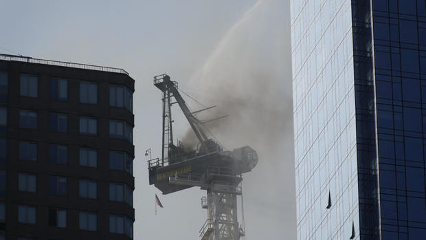 Photos: Crane catches fire, partially collapses in NYC 