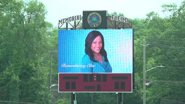 A photo of Elise Finch is displayed on a jumbotron at Memorial Field. 