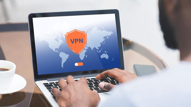 Man using laptop with VPN 
