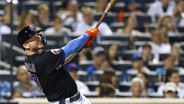 Pete Alonso #20 of the New York Mets hits a two-run home run during the seventh inning against the Washington Nationals at Citi Field on July 28, 2023 in New York City. 