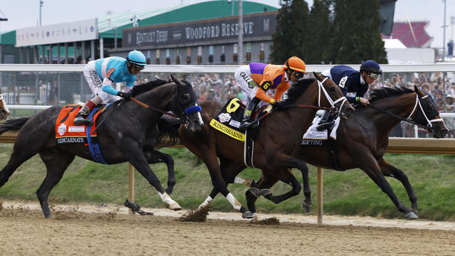 Reincarnate, Kingsbarns and Verifying race tight around turn one during the 149th running of the Kentucky Derby at Churchill Downs on May 06, 2023 in Louisville, Kentucky. 