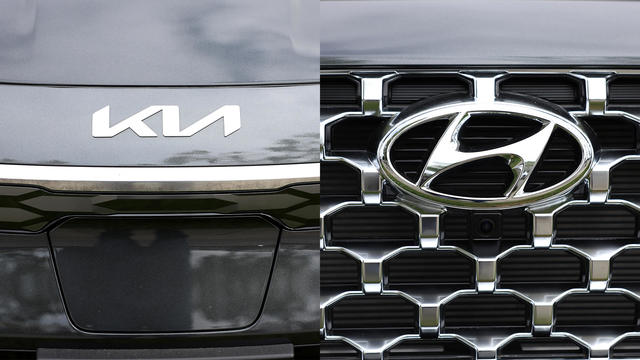 Left: The Kia logo is displayed on a new car; Right: The Hyundai logo is displayed on a new car 
