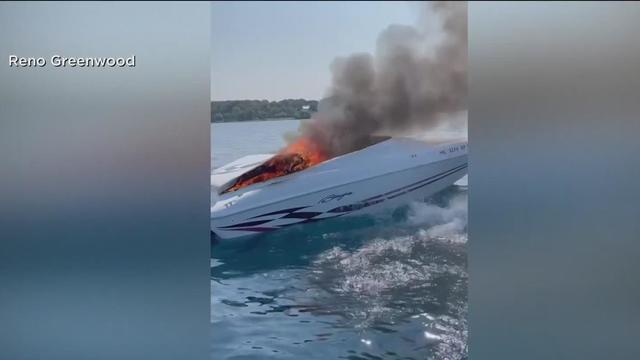 Video captures 2 people jumping from boat engulfed in flames in Michigan.jpg 