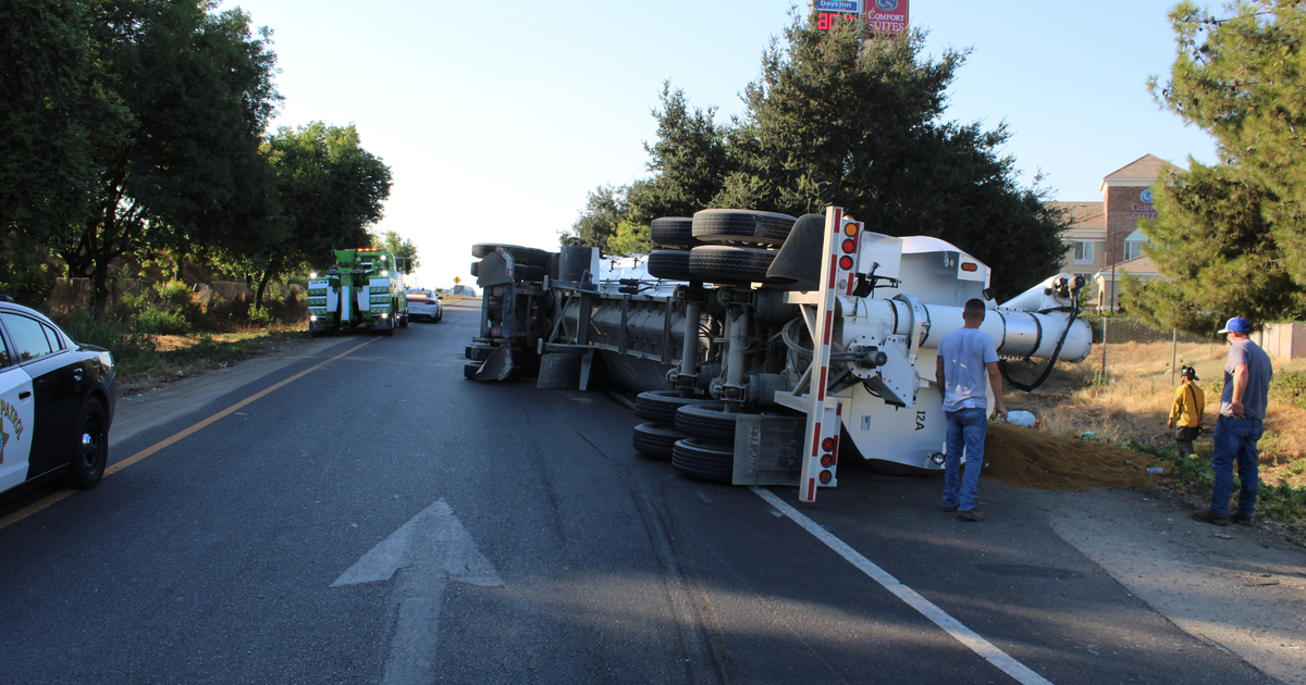 Overturned big rig spills 50K pounds of turkey seed on Modesto highway on-ramp