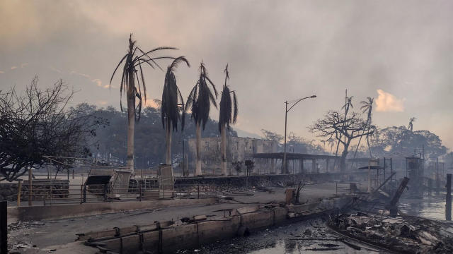 A charred boat lies in the scorched waterfront after wildfires fanned by the winds of a distant hurricane devastated Maui's city of Lahaina, Hawaii, August 9, 2023. 
