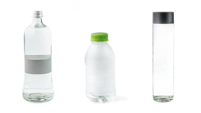 set of various plastic and glass bottles with spring clean water on white background isolated 