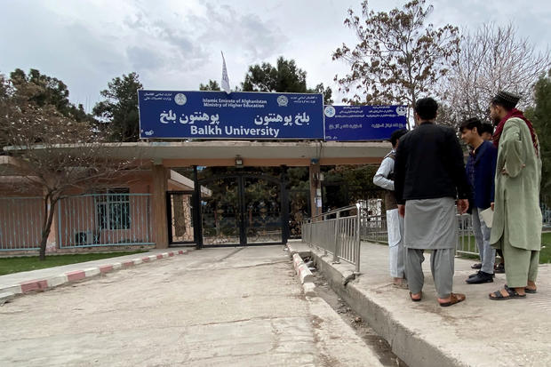 Male students arrive at Balkh University after the universities were reopened in Mazar-i-Sharif on March 6, 2023. 