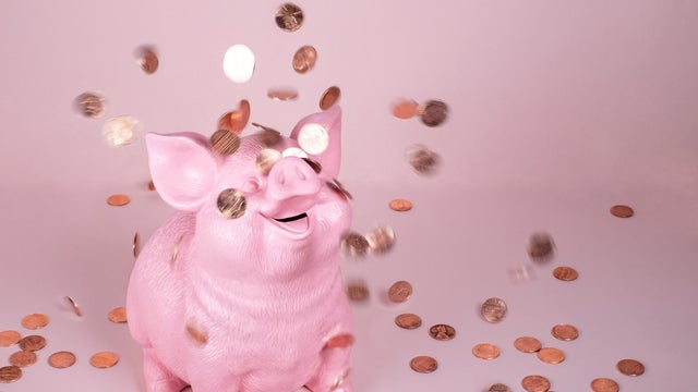 Piggy Coin Bank with falling pennies 