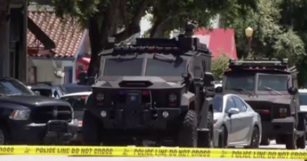 Shooting suspect who killed woman arrested after hours-long standoff in ...