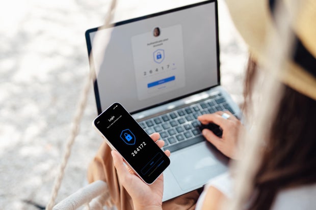Woman using laptop and password
