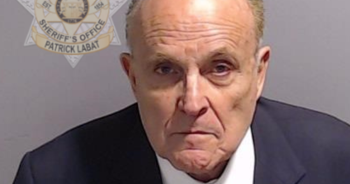 See Rudy Giuliani’s mug shot after the embattled Trump ally turned himself in at Fulton County Jail