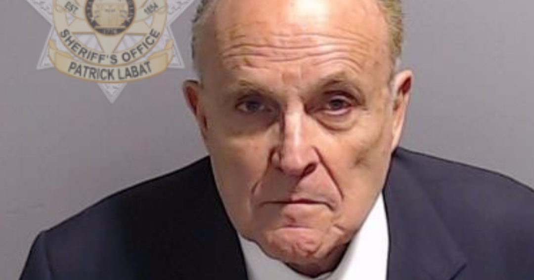 See Rudy Giuliani’s mug shot after the embattled Trump ally turned himself in at Fulton County Jail