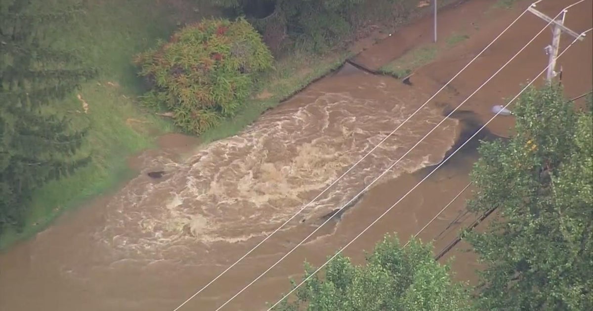 Water main break floods road in Middletown, New Jersey - CBS New York