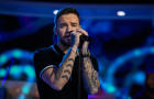 Liam Payne singing on stage 