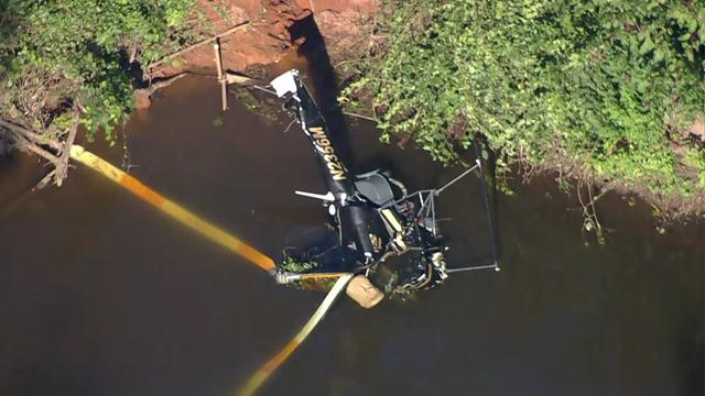 A helicopter crashed into a body of water. 