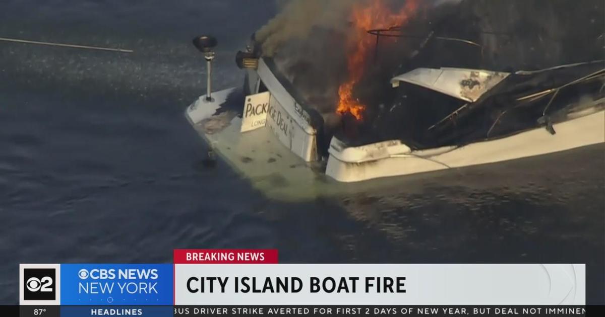 Boat sinks after catching fire near City Island