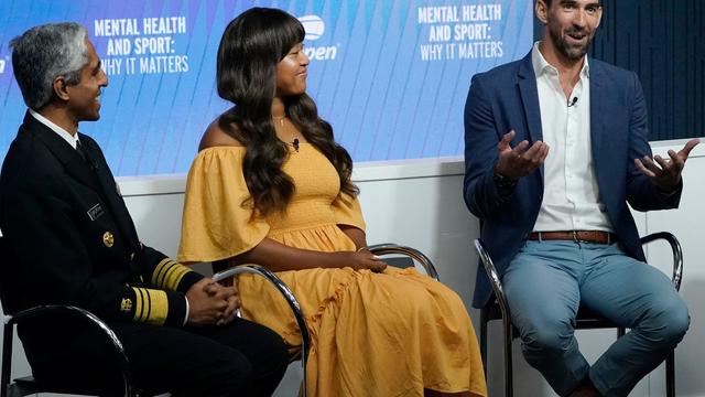 US Surgeon General Dr. Vivek Murthy, Japan's Naomi Osaka, and US swimmer Michael Phelps participate in a mental health forum entitled "Mental Health and Sport: Why It Matters," on the sidelines of the US Open tennis tournament at the USTA Billie Jean King 