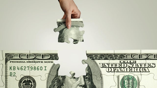 100 dollar pill puzzle being put together 