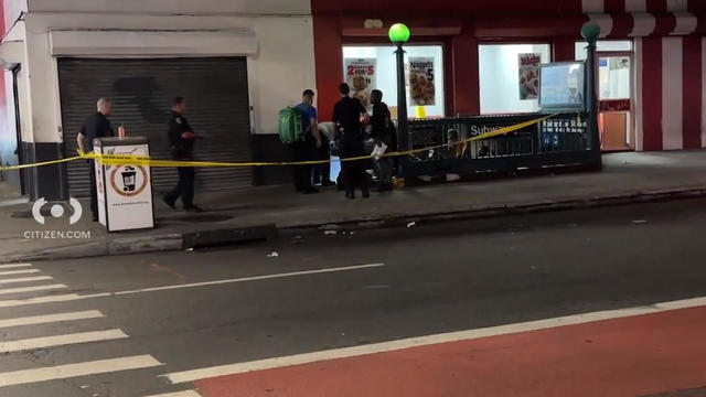 Crime scene tape blocks off the entrance to a subway station as police investigate. 