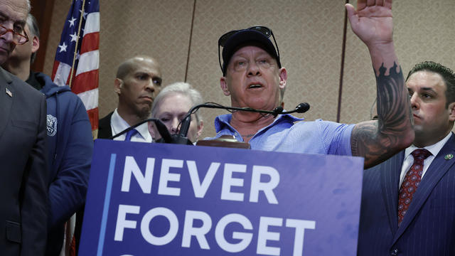 Ground Zero worker and first responder advocate John Feal (C) calls for additional federal funding for people who were sickened by their exposure to toxins following the 9/11 terror attacks during a news conference with fellow advocates, survivors and mem 
