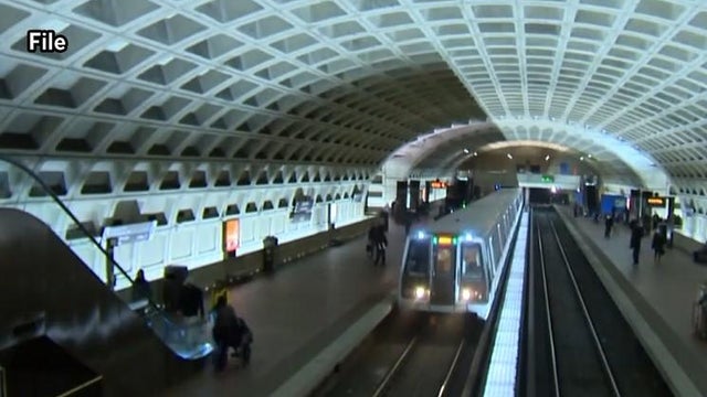 A 1 train pulls into a subway station. 