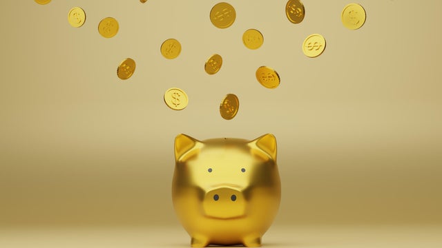 Golden piggy bank and golden coins, 3d render 