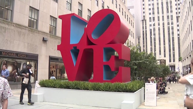 The red "LOVE Statue" in Rockefeller Center. 